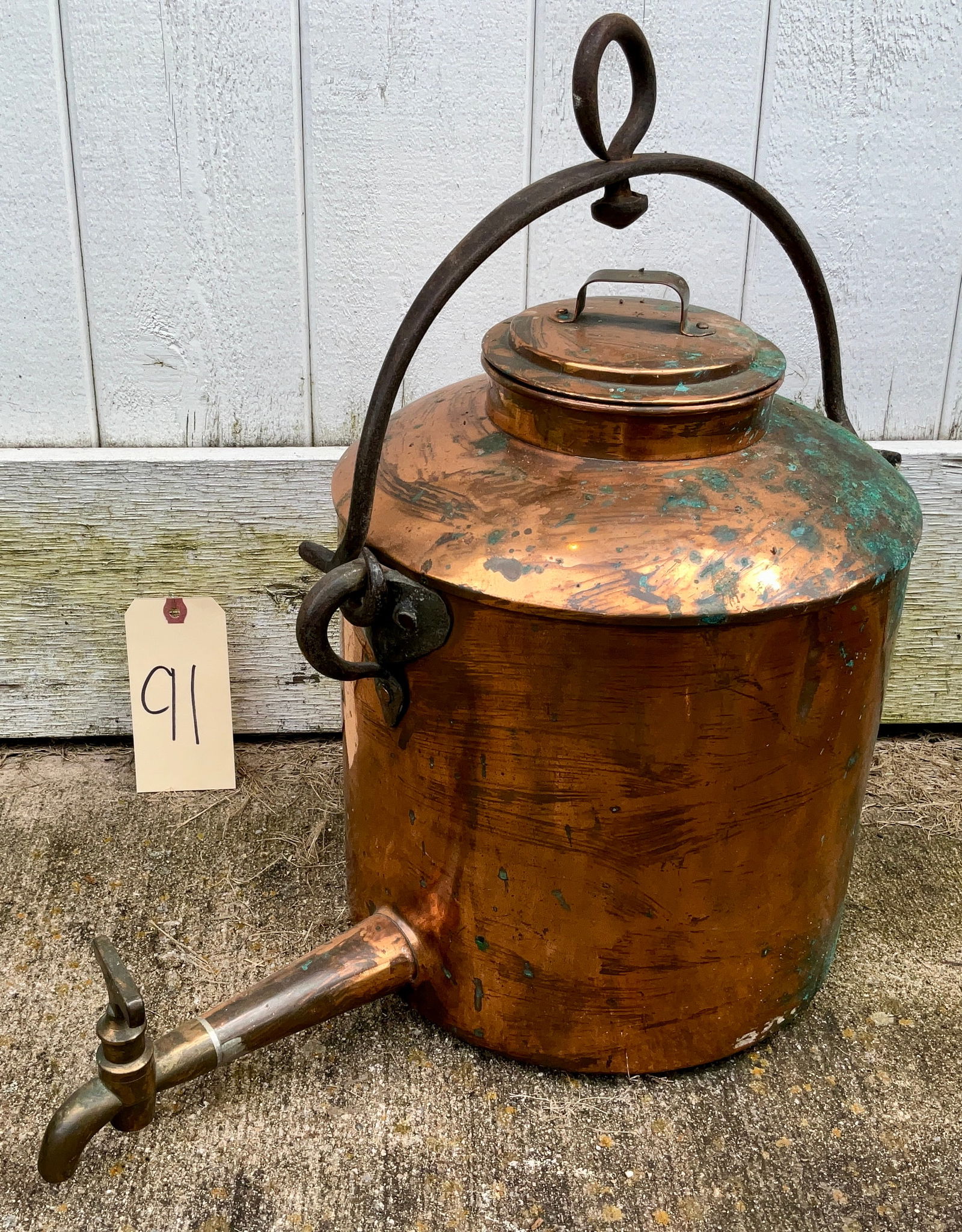 ANTIQUE HANGING COPPER WATER URN WITH IRON HANDLE AND BRASS SPIGOT. (1 of 4)