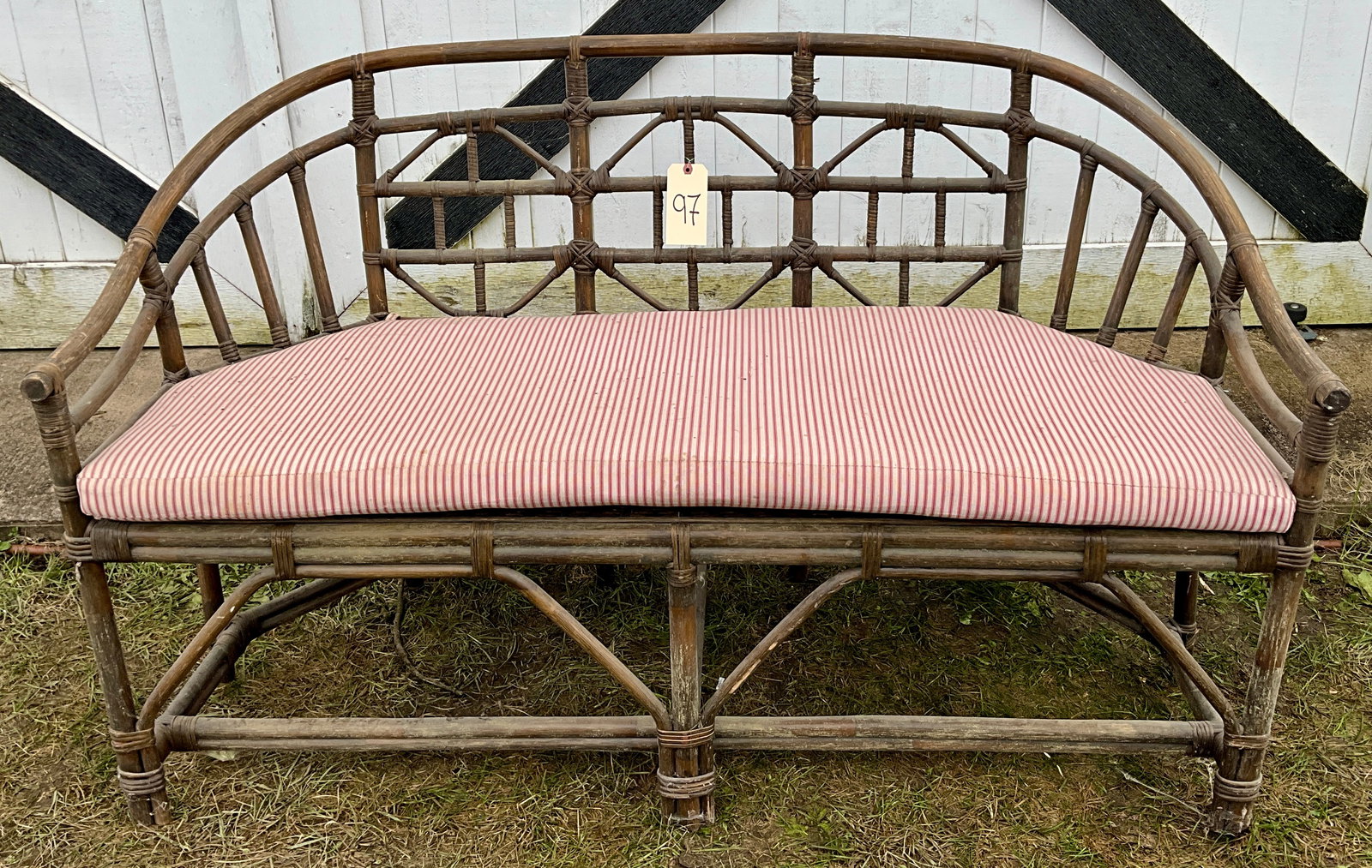 VINTAGE RATTAN 57"L BENCH: VINTAGE RATTAN 57"L BENCH Condition All property is sold in "as is" condition and all sales are final. Teel Auctions and its consignor make no representations or warranties, express or implied, with r