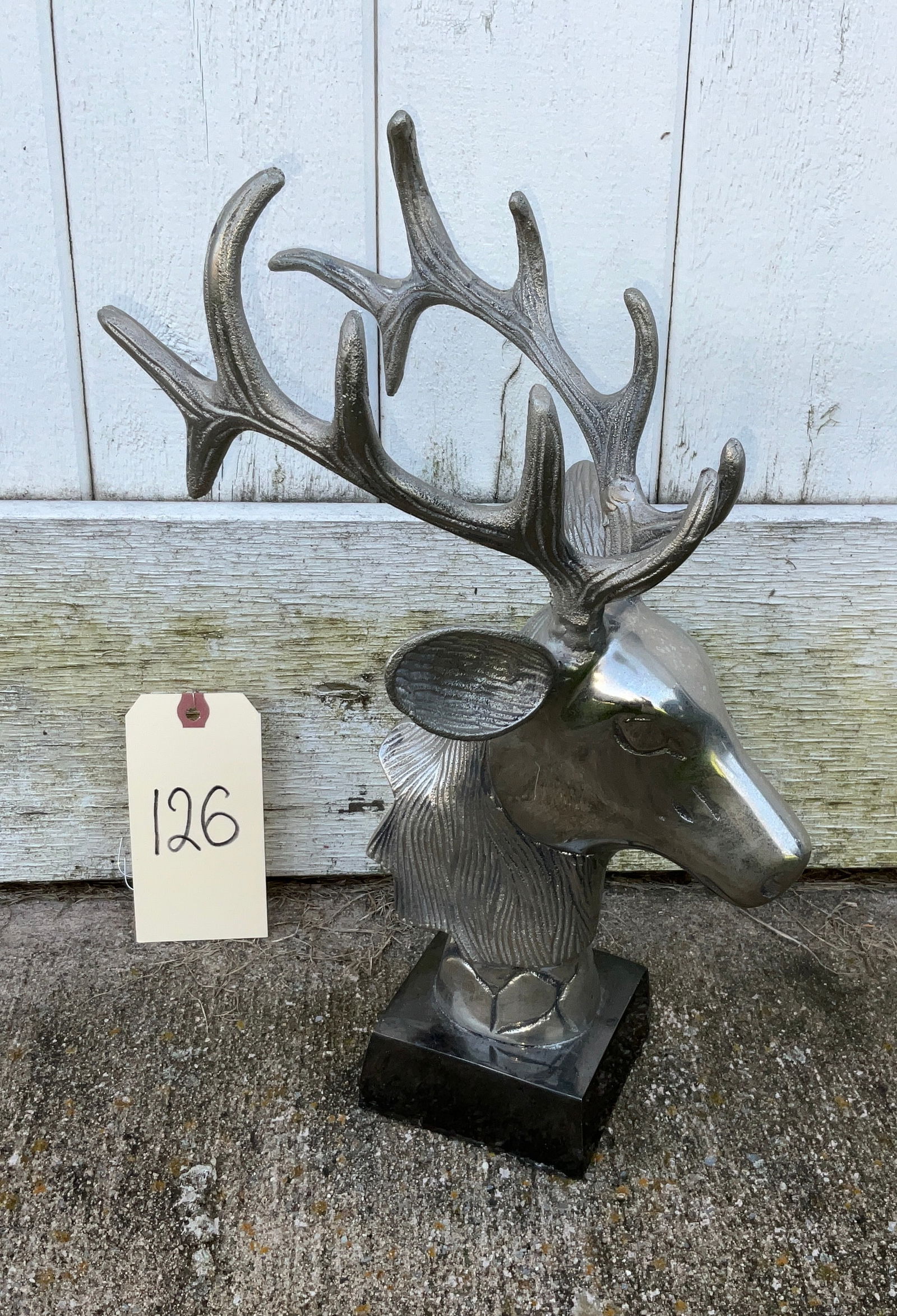 MODERN POLISHED CAST ALUMINUM DEER BUST ON PEDESTAL.: MODERN POLISHED CAST ALUMINUM DEER BUST ON PEDESTAL. MEASURES 15"H. Condition All property is sold in "as is" condition and all sales are final. Teel Auctions and its consignor make no representations