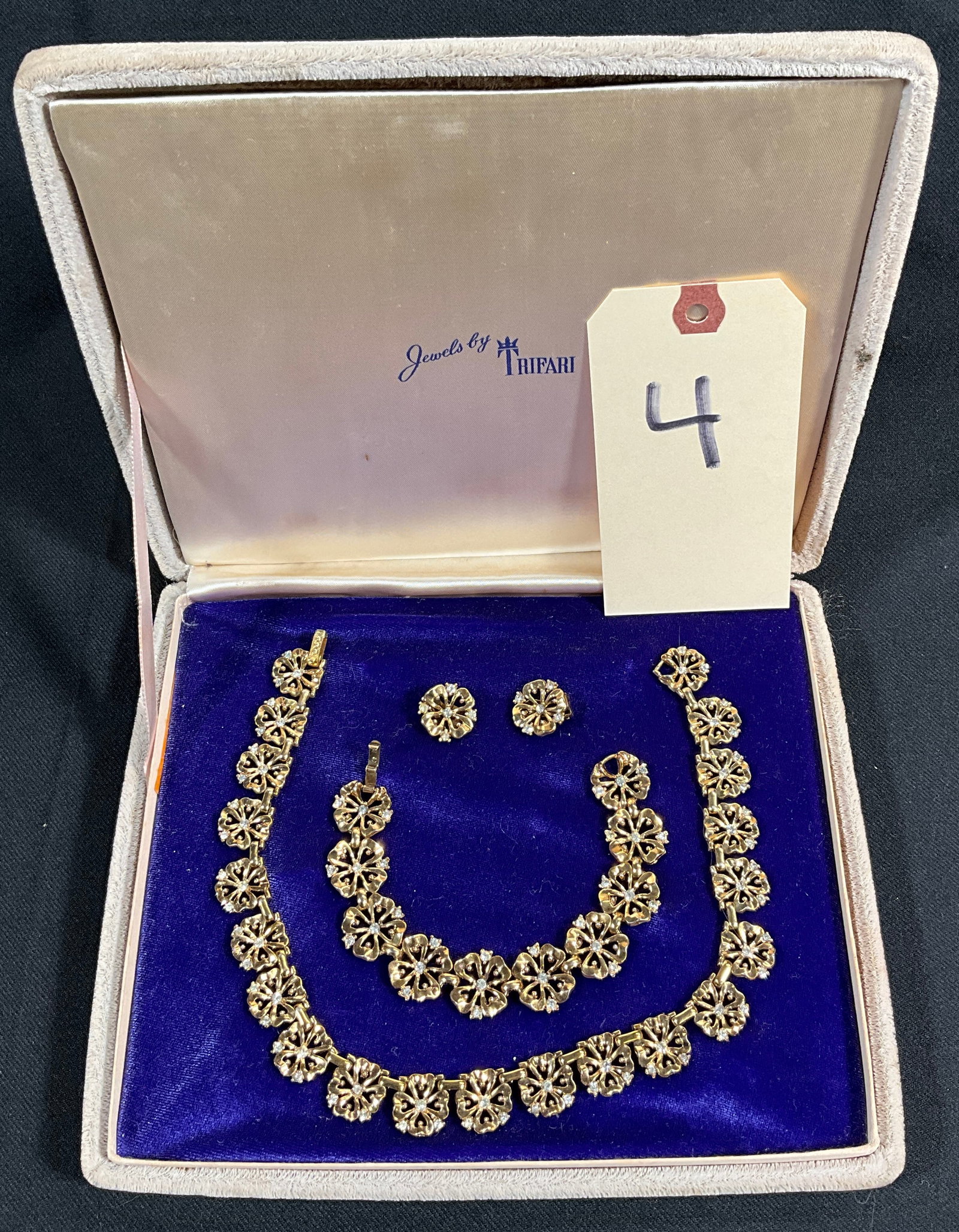 TRIFARI NECKLACE, EARRINGS, AND BRACELET SET WITH CASE.: TRIFARI NECKLACE, EARRINGS, AND BRACELET SET WITH CASE. Condition All property is sold in "as is" condition and all sales are final. Teel Auctions and its consignor make no representations or warranti