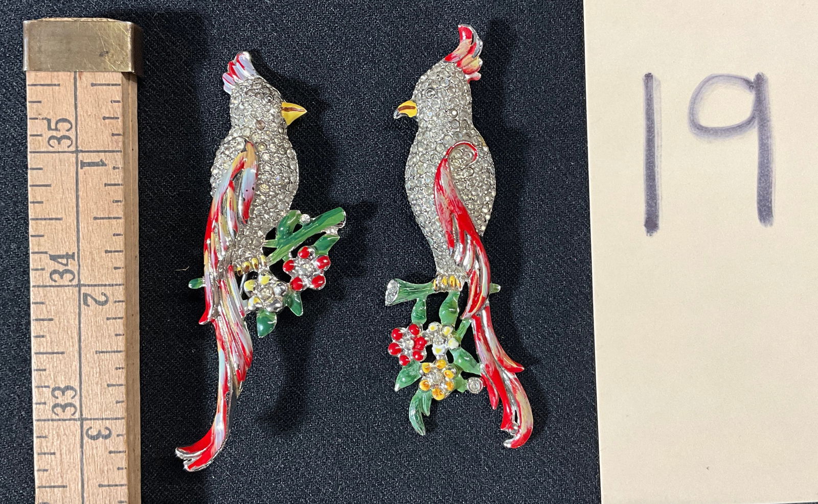 PAIR OF CORO DUETTE ENAMEL PAINTED RHINESTONE PARROT BROOCHES.: PAIR OF CORO DUETTE ENAMEL PAINTED RHINESTONE PARROT BROOCHES. Condition All property is sold in "as is" condition and all sales are final. Teel Auctions and its consignor make no representations or w
