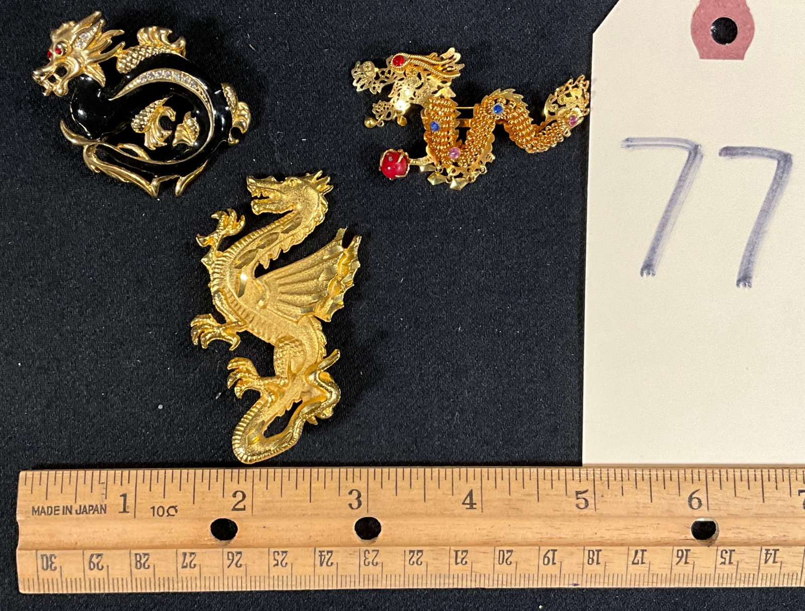 3 PC UNMARKED ASIAN DRAGON BROOCHES.: 3 PC UNMARKED ASIAN DRAGON BROOCHES. Condition All property is sold in "as is" condition and all sales are final. Teel Auctions and its consignor make no representations or warranties, express or impl