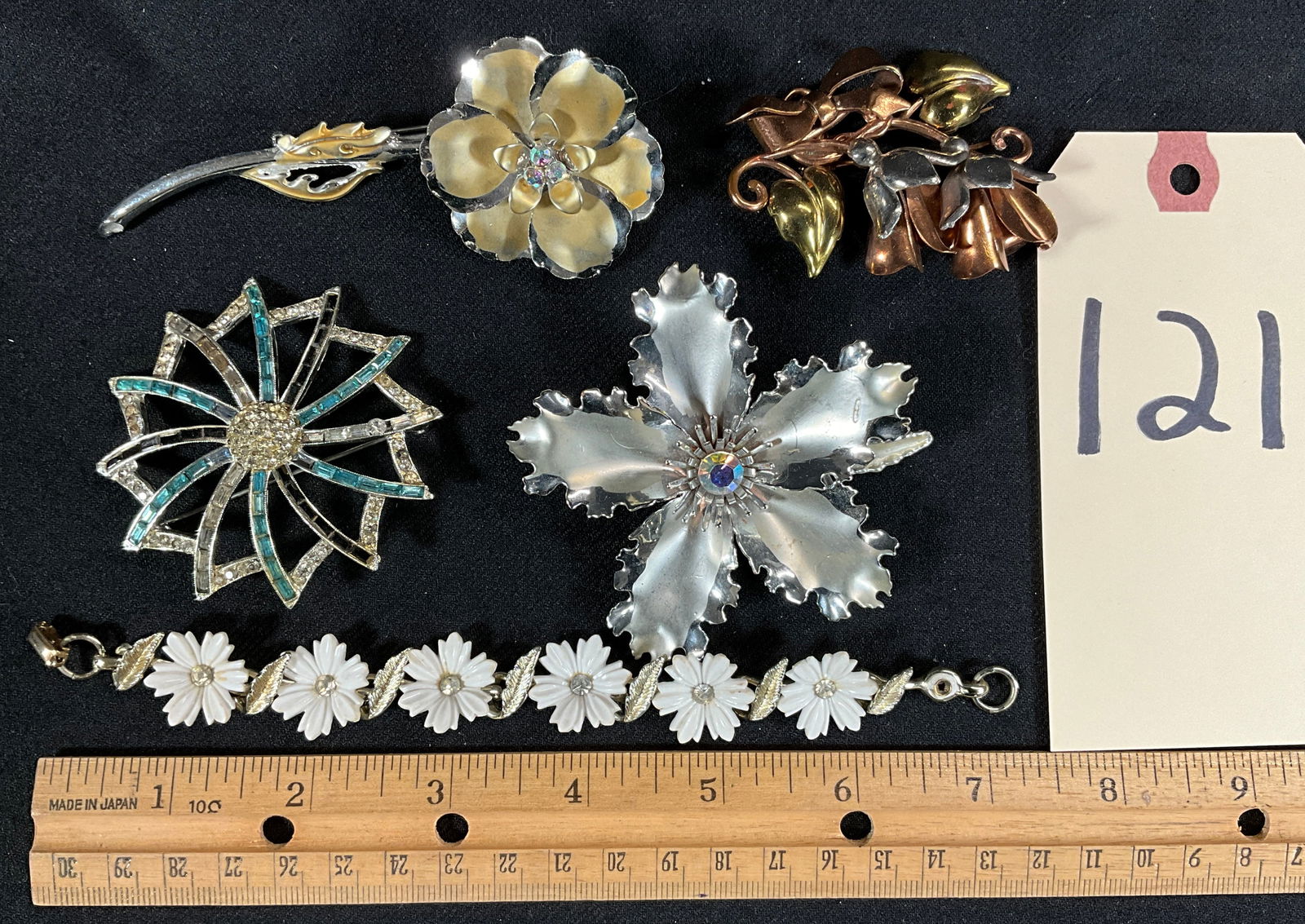 ASSORTED VINTAGE FLORAL BROOCHES WITH CORO FLORAL BRACELET.: ASSORTED VINTAGE FLORAL BROOCHES WITH CORO FLORAL BRACELET. Condition All property is sold in "as is" condition and all sales are final. Teel Auctions and its consignor make no representations or warr