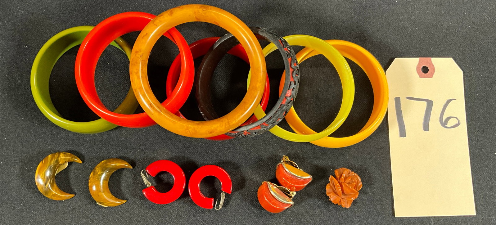 ASSORTED BAKELITE BRACELETS AND EARRINGS SETS.: ASSORTED BAKELITE BRACELETS AND EARRINGS SETS. Condition All property is sold in "as is" condition and all sales are final. Teel Auctions and its consignor make no representations or warranties, expre