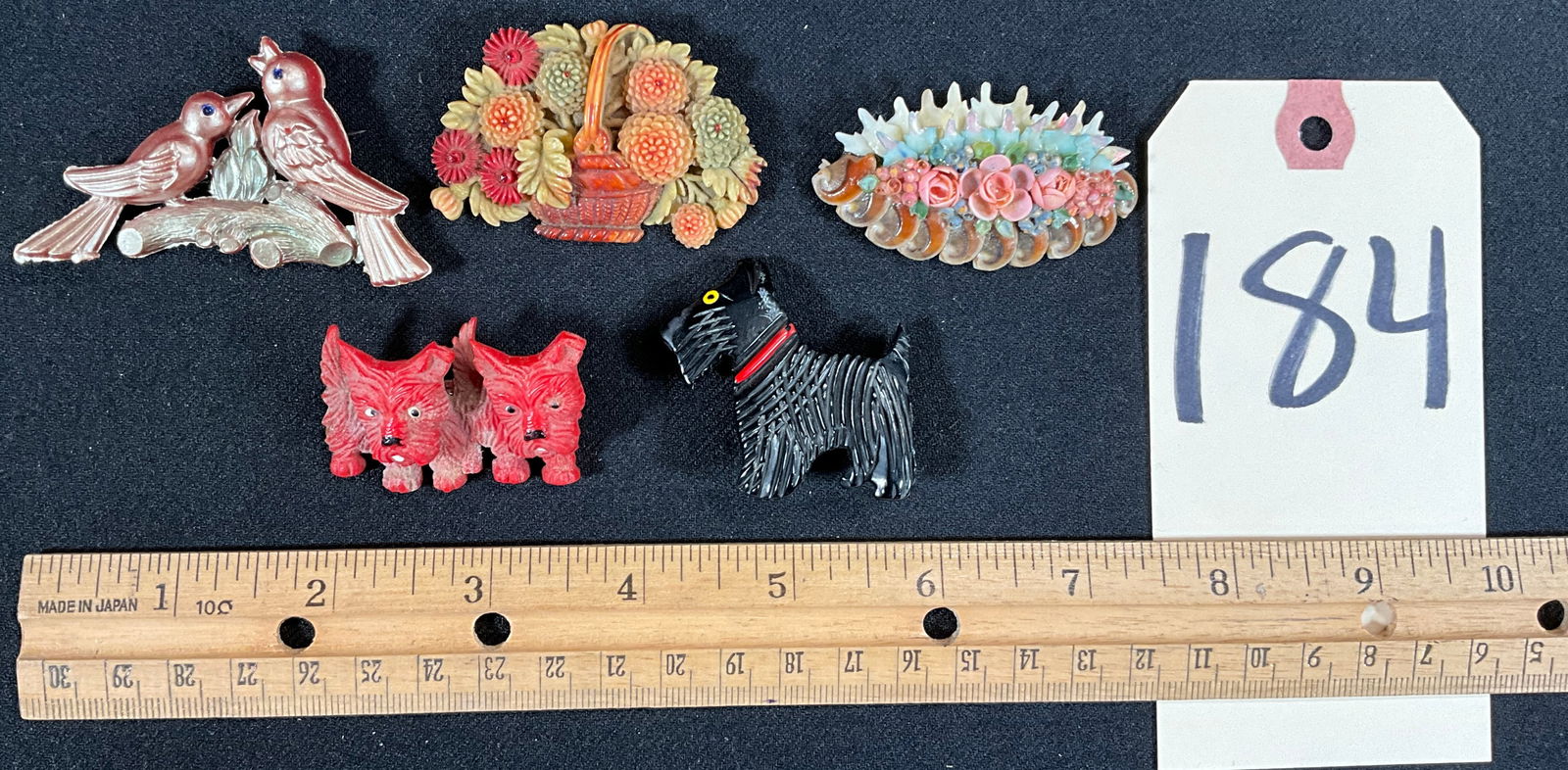 5 PC CELLULOID, BAKELITE, AND COMPOSITE ANIMAL AND FLORAL BROOCHES. (1 of 3)