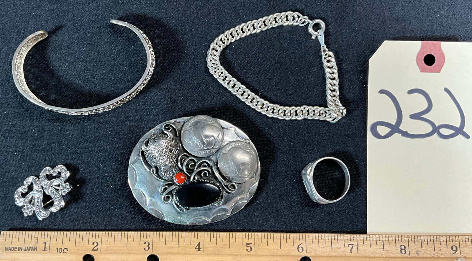 VINTAGE UNMARKED BRACELETS, RING, BROOCH, AND SOUTHWESTERN BELT BUCKLE.: VINTAGE UNMARKED BRACELETS, RING, BROOCH, AND SOUTHWESTERN BUFFALO NICKEL BELT BUCKLE. Condition All property is sold in "as is" condition and all sales are final. Teel Auctions and its consignor make