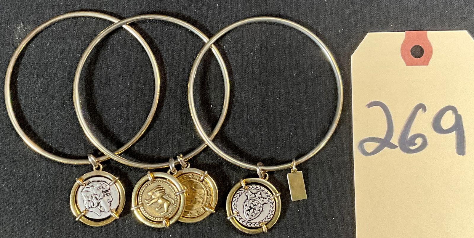 3 PC TOMMY HILFIGER CHARM BRACELETS.: 3 PC TOMMY HILFIGER CHARM BRACELETS. MEASURES 2.75" DIAMETER. Condition All property is sold in "as is" condition and all sales are final. Teel Auctions and its consignor make no representations or wa