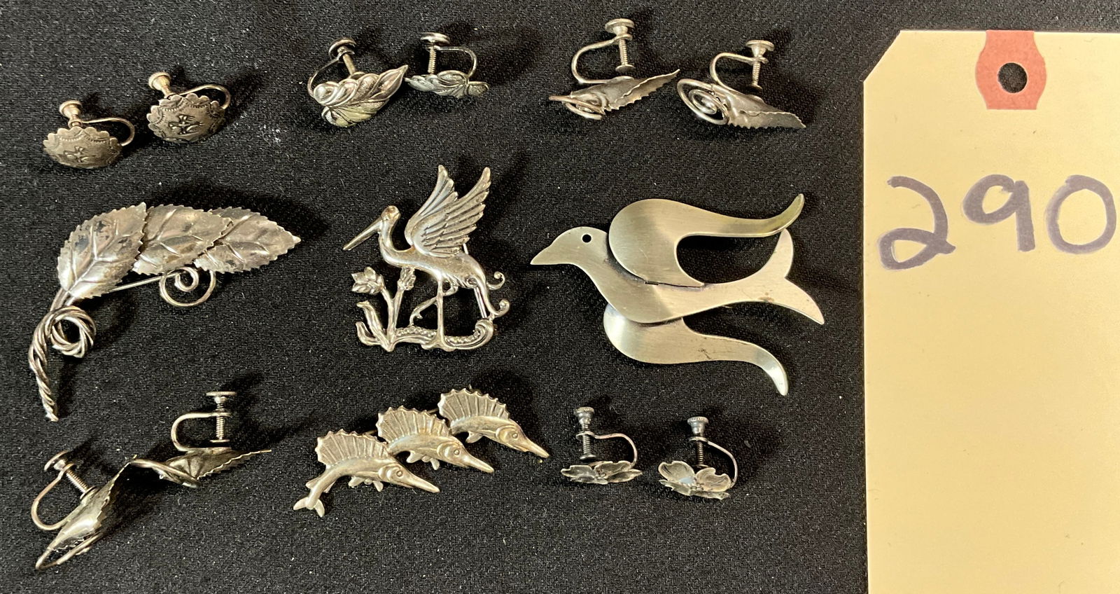 LARGE LOT OF STERLING SILVER BROOCHES AND EARRINGS.: LARGE LOT OF STERLING SILVER BROOCHES AND EARRINGS. TOTAL WEIGHT 38.08 GRAMS. FROM CORO, BEAUCRAFT, BEAU, AND OTHERS. Condition All property is sold in "as is" condition and all sales are final. Teel