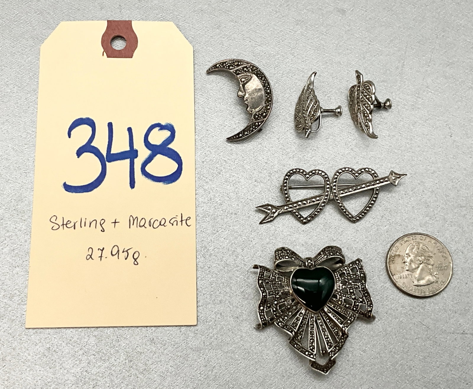 5 PC STERLING SILVER AND MARCASITE BROOCHES AND EARRINGS LOT.: 5 PC STERLING SILVER AND MARCASITE BROOCHES AND EARRINGS LOT. TOTAL WEIGHT 27.95 GRAMS. Condition All property is sold in "as is" condition and all sales are final. Teel Auctions and its consignor mak