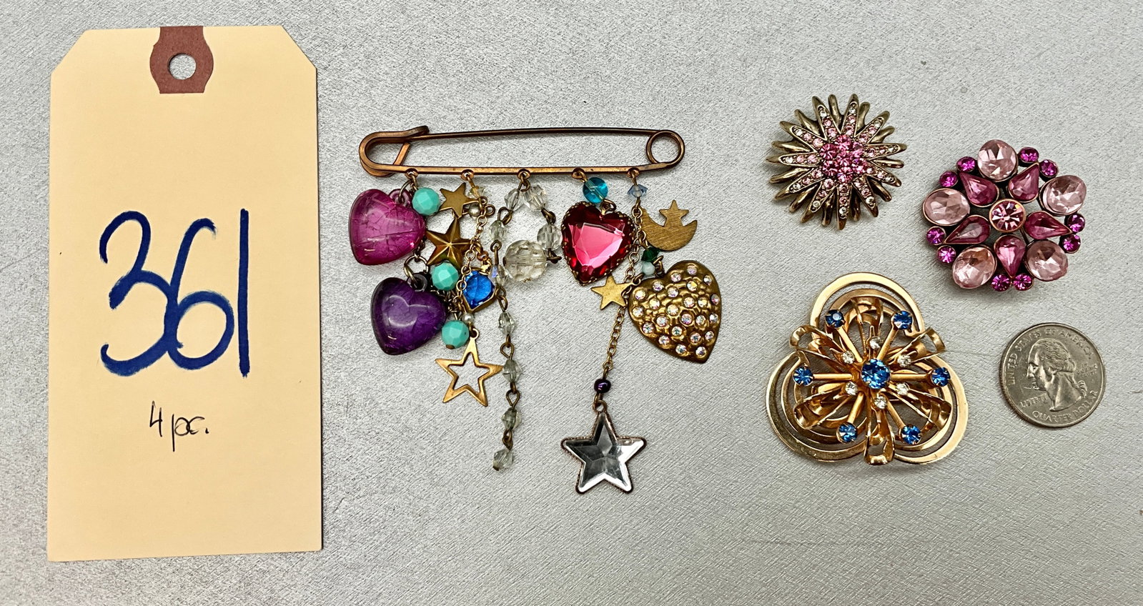ASSORTED GEMSTONE ENCRUSTED BROOCHES WITH SAFETY PIN CHARM BROOCH.: ASSORTED GEMSTONE ENCRUSTED BROOCHES WITH SAFETY PIN CHARM BROOCH. Condition All property is sold in "as is" condition and all sales are final. Teel Auctions and its consignor make no representations 