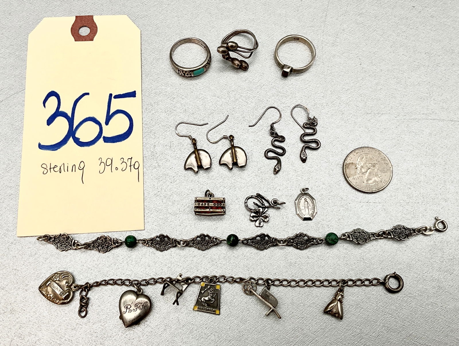 STERLING SILVER CHARMS, BRACELETS, AND EARRINGS.: STERLING SILVER CHARMS, BRACELETS, AND EARRINGS. TOTAL 39.37 GRAMS. Condition All property is sold in "as is" condition and all sales are final. Teel Auctions and its consignor make no representations