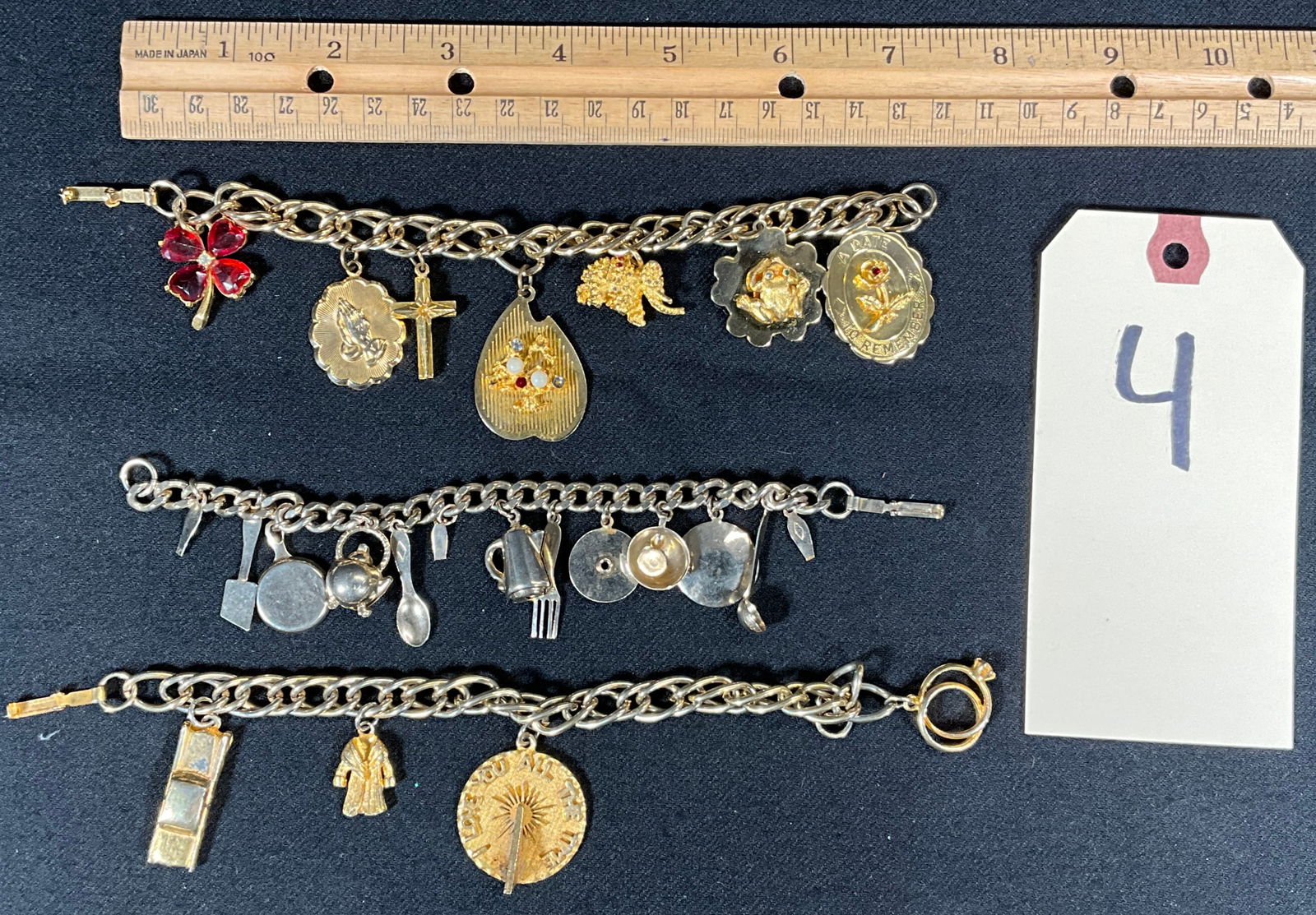 3 PC UNMARKED CHARM BRACELETS.: 3 PC UNMARKED CHARM BRACELETS. SOME MARKED OB CO. Condition All property is sold in "as is" condition and all sales are final. Teel Auctions and its consignor make no representations or warranties, ex