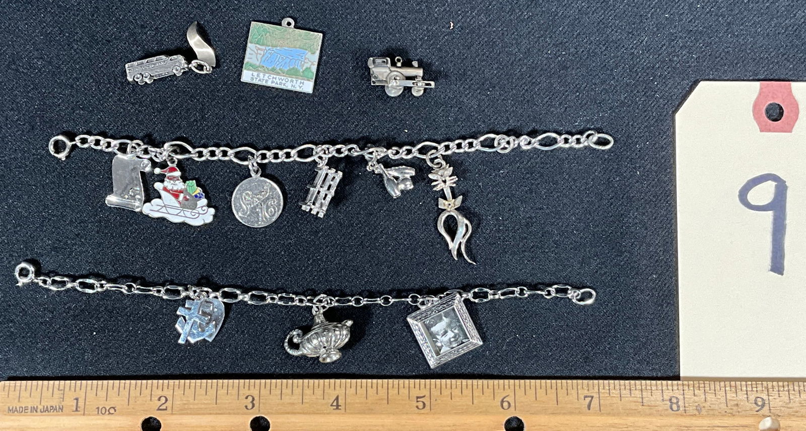 STERLING AND UNMARKED CHARM BRACELETS.: STERLING AND UNMARKED CHARM BRACELETS. 2 CHARMS MARKED STERLING. Condition All property is sold in "as is" condition and all sales are final. Teel Auctions and its consignor make no representations or
