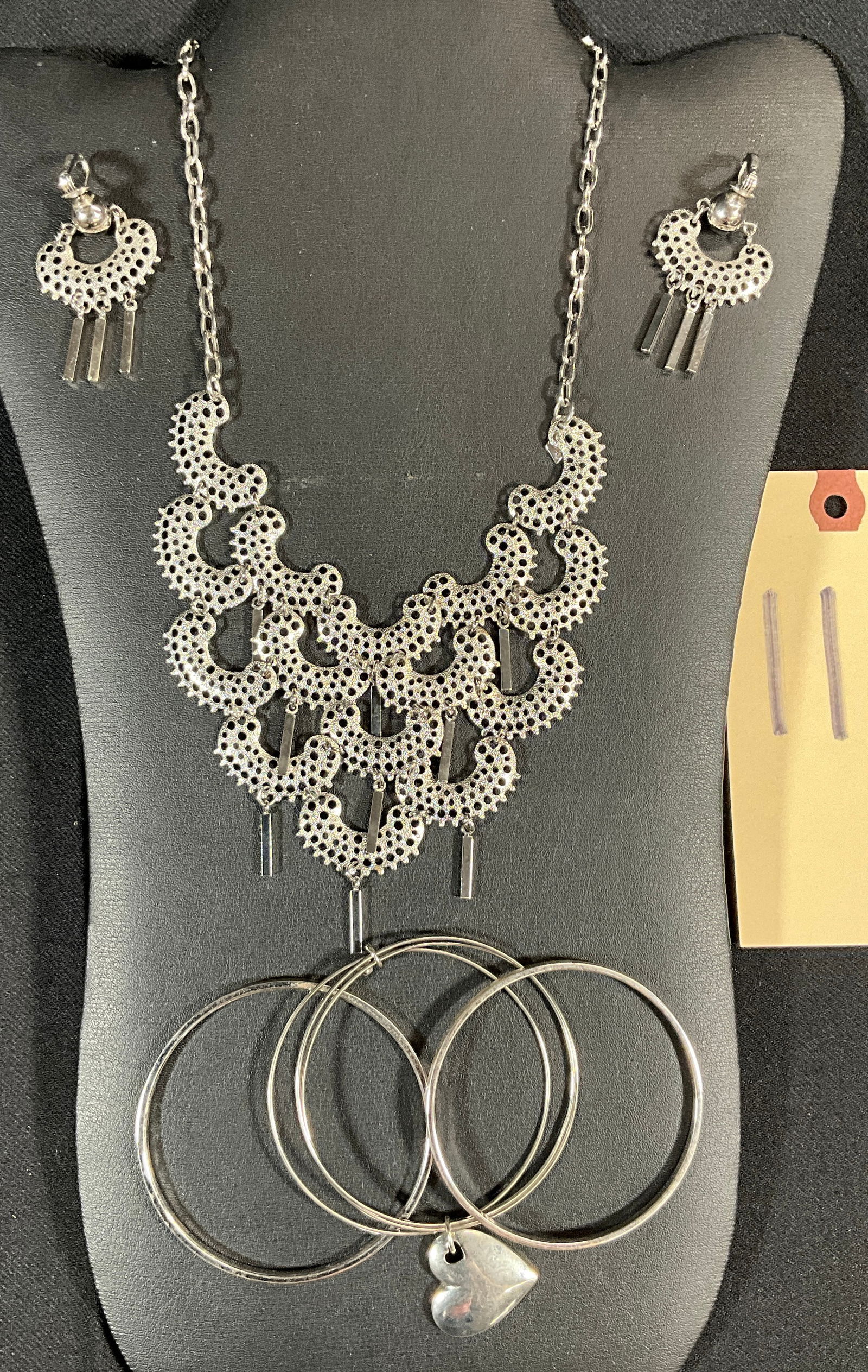 SIGNED SARA COVENTRY AND MONET SILVER COLORED BRACELETS WITH NECKLACE AND EARRINGS SET.: SIGNED SARA COVENTRY AND MONET SILVER COLORED BRACELETS WITH NECKLACE AND EARRINGS SET. Condition All property is sold in "as is" condition and all sales are final. Teel Auctions and its consignor mak