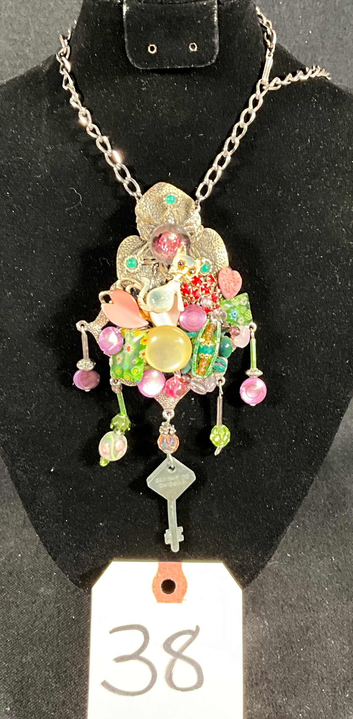 SIGNED SARAH JANE CAT DECORATED NECKLACE.: SIGNED SARAH JANE CAT DECORATED NECKLACE. Condition All property is sold in "as is" condition and all sales are final. Teel Auctions and its consignor make no representations or warranties, express or