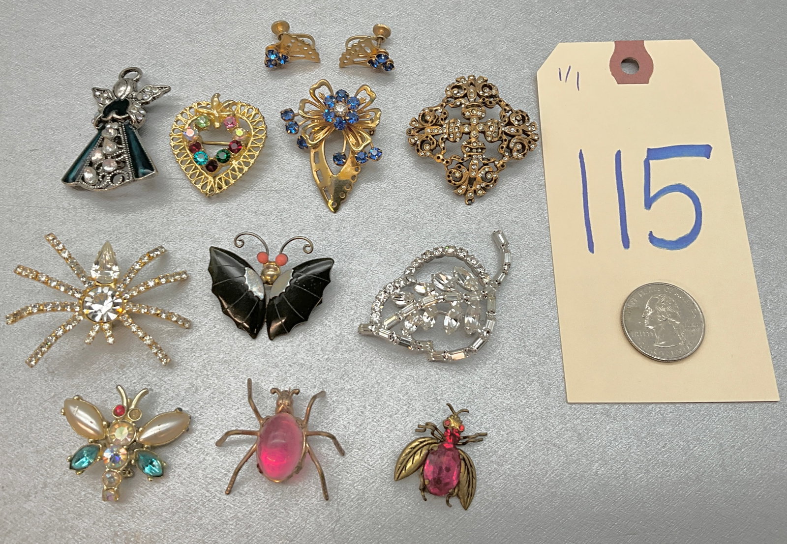 10 PC RHINESTONE DECORATED BROOCH/PINS INCLUDING ONE PIN AND EARRINGS SET.: 10 PC RHINESTONE DECORATED BROOCH/PINS INCLUDING ONE PIN AND EARRINGS SET. FROM DENICOLA, CZECH, AND MORE. Condition All property is sold in "as is" condition and all sales are final. Teel Auctions an