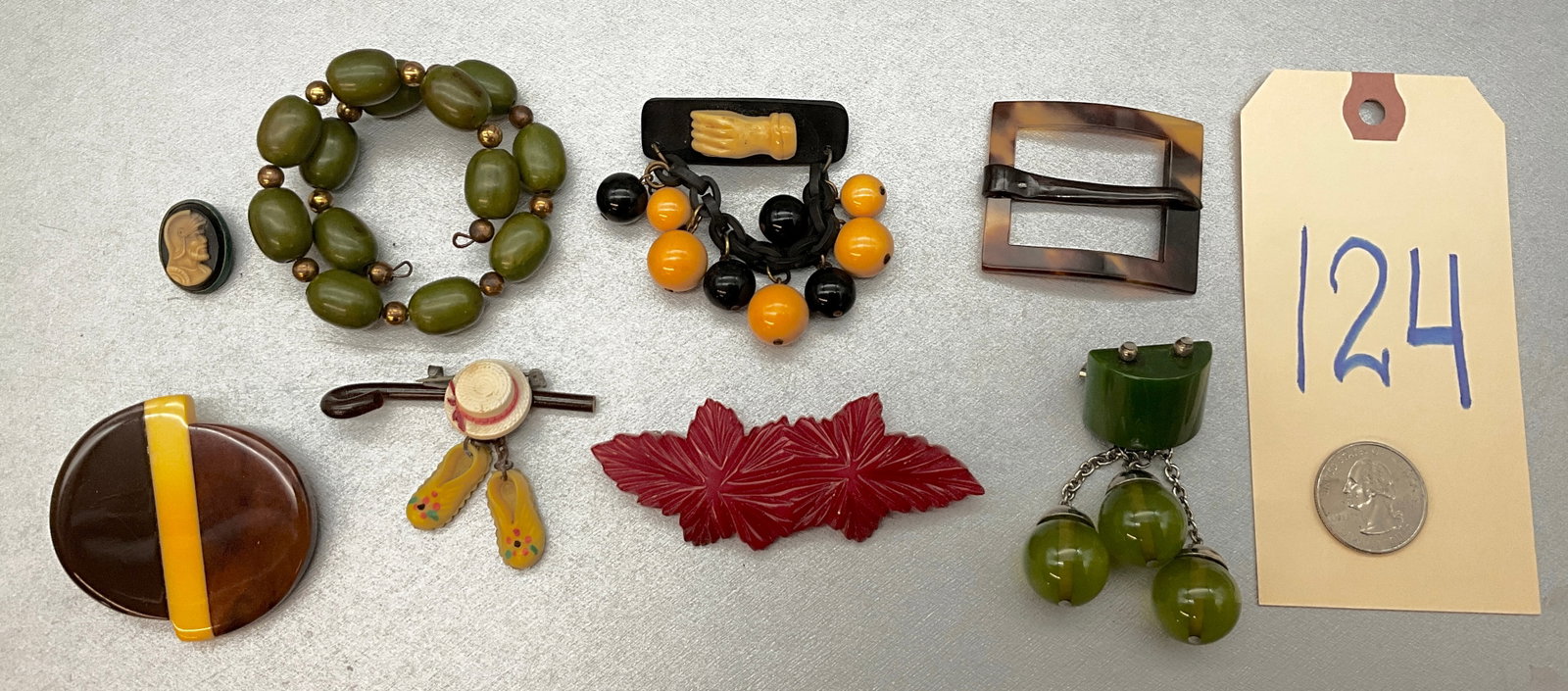 ASSORTED BAKELITE AND MORE JEWELRY LOT.: ASSORTED BAKELITE AND MORE JEWELRY LOT. Condition All property is sold in "as is" condition and all sales are final. Teel Auctions and its consignor make no representations or warranties, express or i