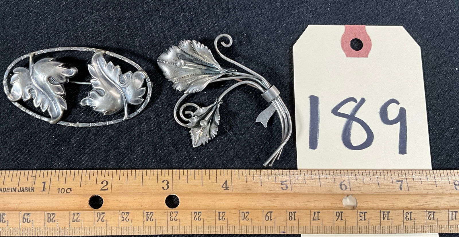 CORO AND UNMARKED STERLING SILVER LEAF AND FLORAL BROOCHES.: CORO AND UNMARKED STERLING SILVER LEAF AND FLORAL BROOCHES. TOTAL WEIGHT OF 22.90 GRAMS. Condition All property is sold in "as is" condition and all sales are final. Teel Auctions and its consignor ma