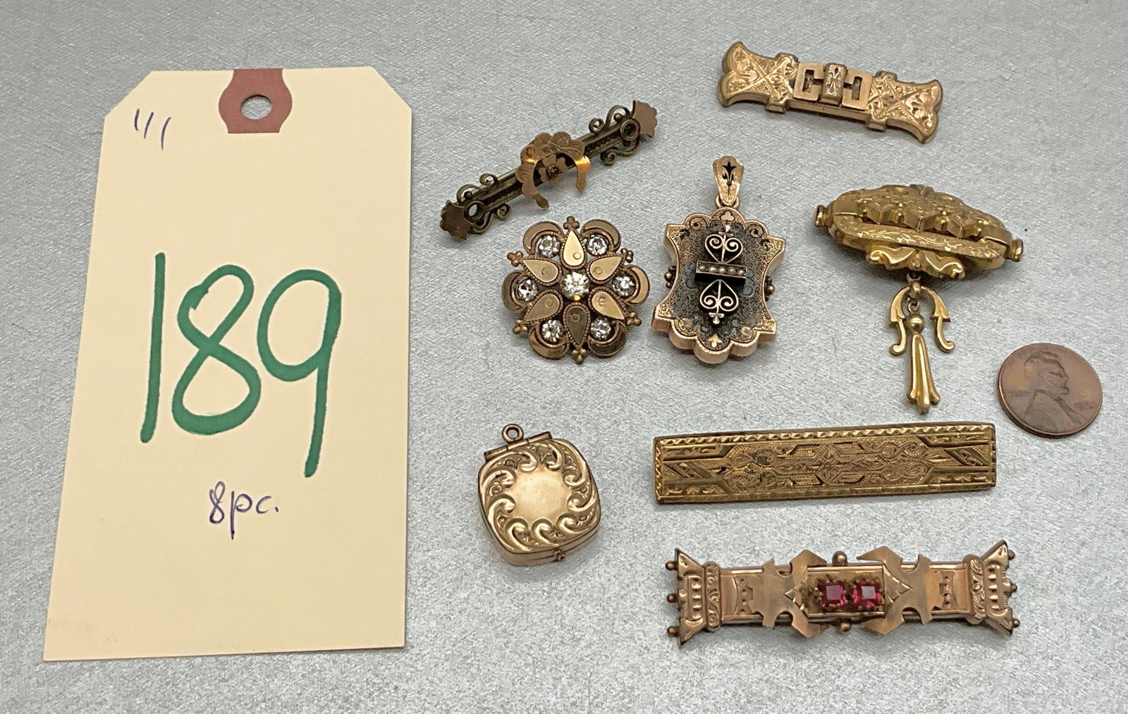 VINAGE BAR PINS/BROOCHES, PENDANTS, AND MORE.: VINAGE BAR PINS/BROOCHES, PENDANTS, AND MORE. Condition All property is sold in "as is" condition and all sales are final. Teel Auctions and its consignor make no representations or warranties, expres