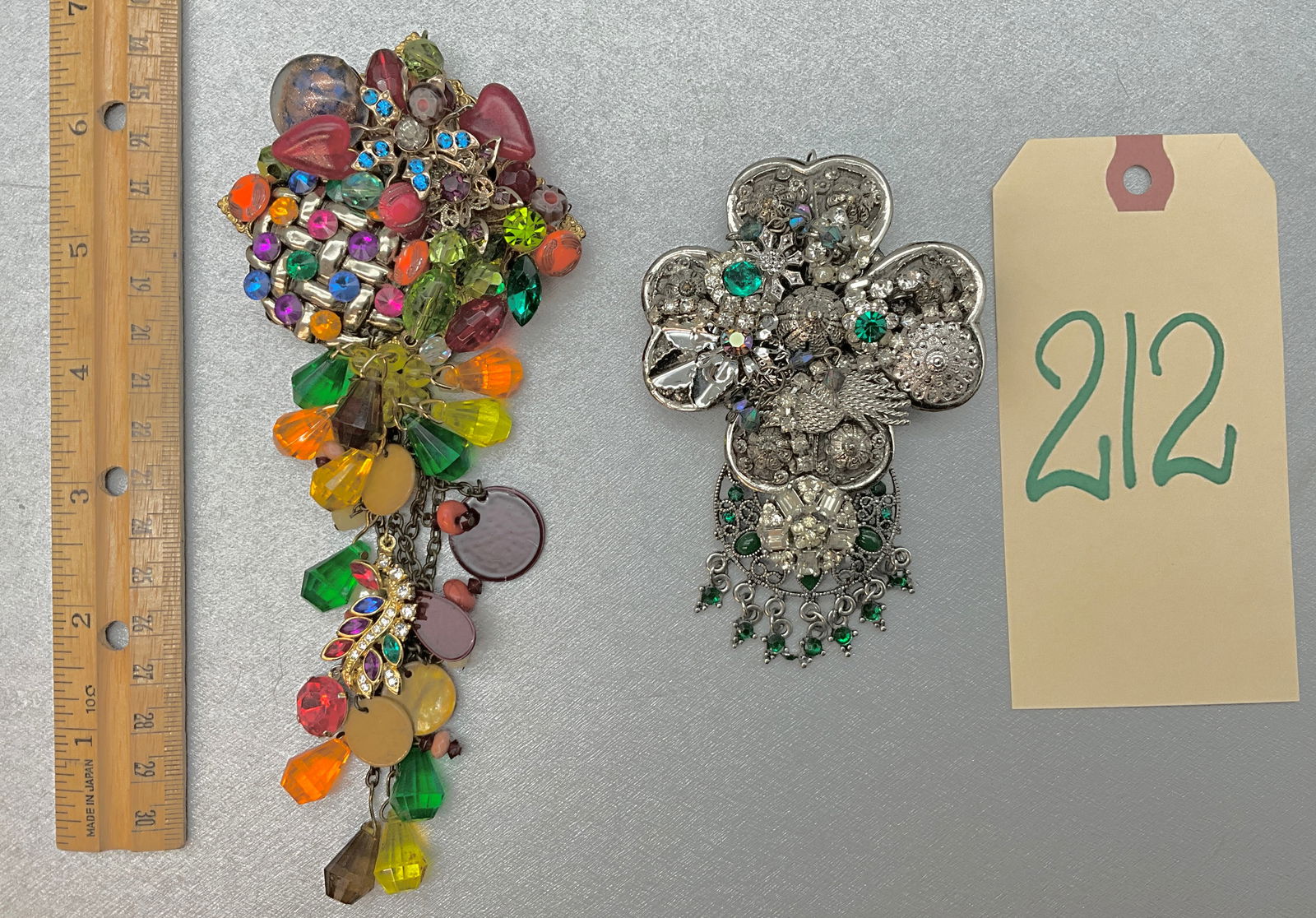 TWO PIECE SARAH JANE SIGNED MOSAIC BROOCHES.: TWO PIECE SARAH JANE SIGNED MOSAIC BROOCHES. Condition All property is sold in "as is" condition and all sales are final. Teel Auctions and its consignor make no representations or warranties, express