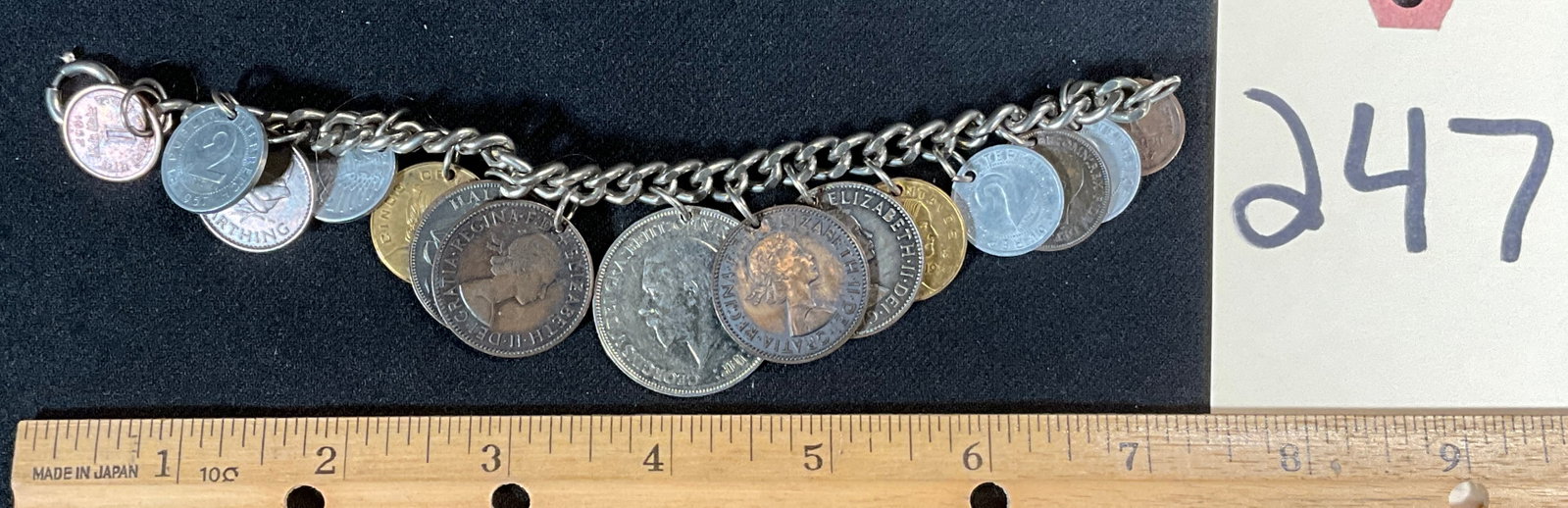 FOREIGN COIN AND TOKEN BRACELET.: FOREIGN COIN AND TOKEN BRACELET. Condition All property is sold in "as is" condition and all sales are final. Teel Auctions and its consignor make no representations or warranties, express or implied,