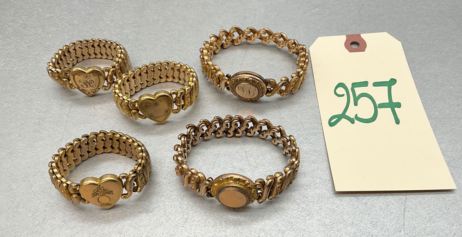 5 PC HEART AND LOCKET STRETCH BRACELETS MARKED PITMAN AND KEELER AND OTHERS. (1 of 7)