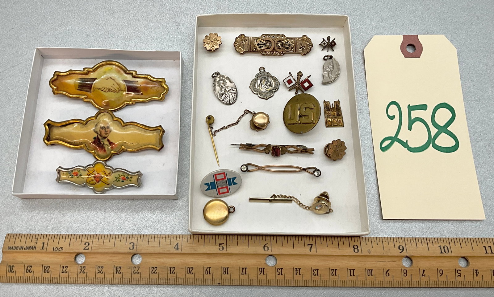VINTAGE BAR PINS, CLIPS, PENDANTS, AND MORE.: VINTAGE BAR PINS, CLIPS, PENDANTS, AND MORE. Condition All property is sold in "as is" condition and all sales are final. Teel Auctions and its consignor make no representations or warranties, express