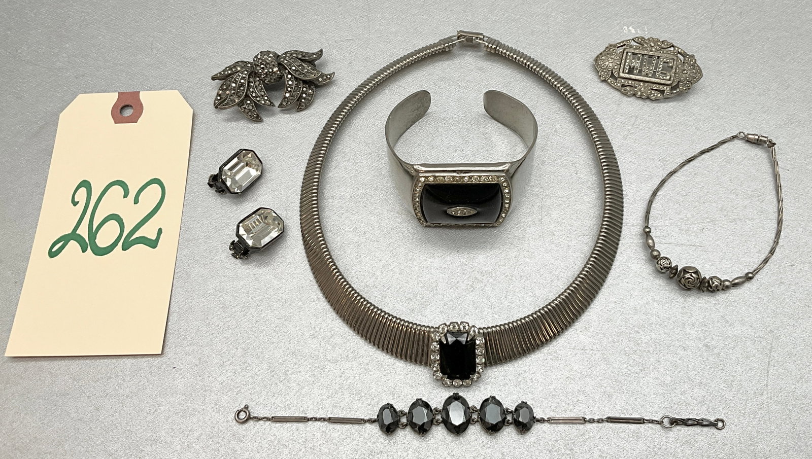 8 PC MARCASITE, BLACK STONE, AND CLEAR RHINESTONE JEWELRY.: 8 PC MARCASITE, BLACK STONE, AND CLEAR RHINESTONE JEWELRY. UNMARKED. Condition All property is sold in "as is" condition and all sales are final. Teel Auctions and its consignor make no representation