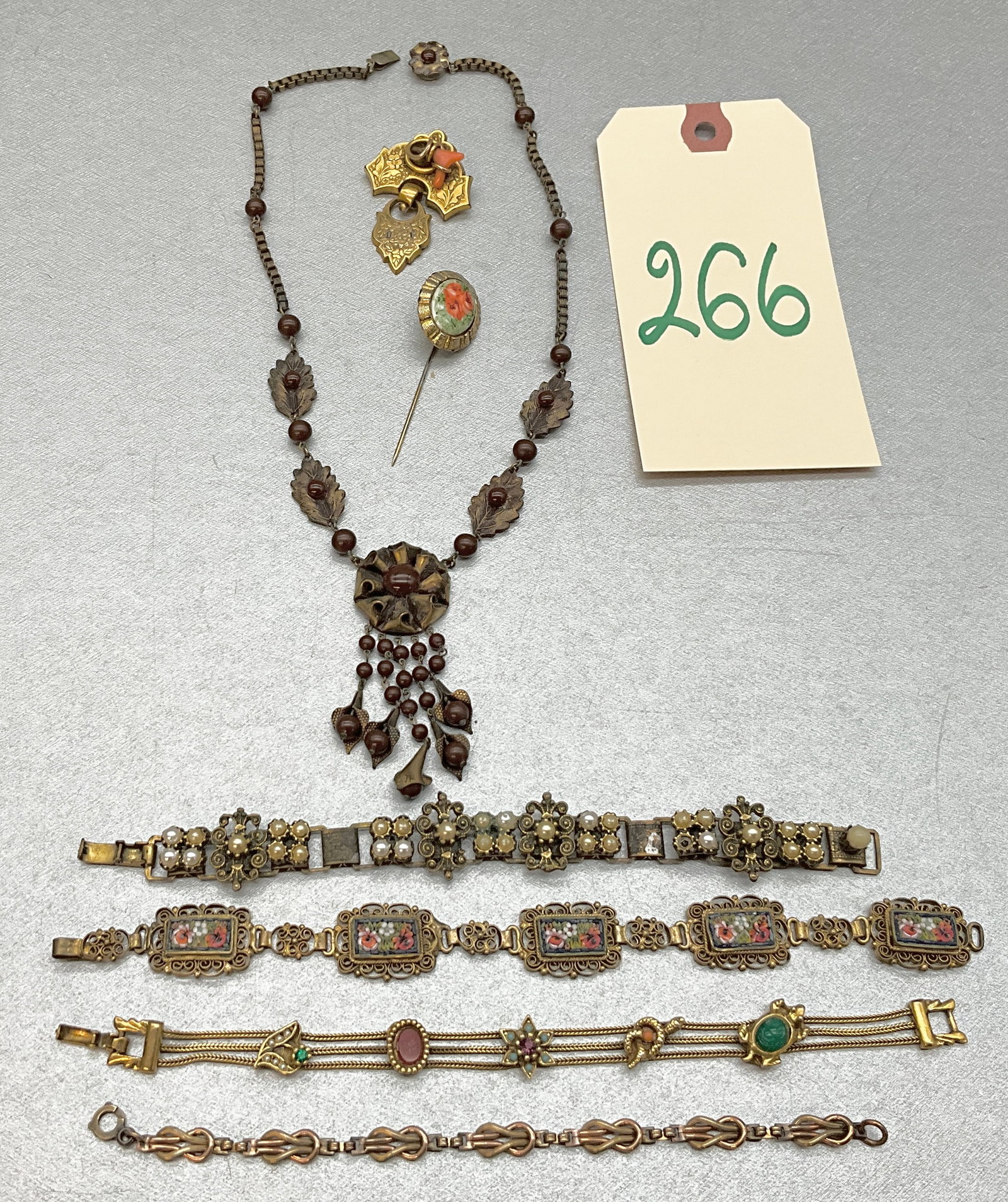 VINTAGE BRACELETS, NECKLACE, STICK PIN, AND MORE.: VINTAGE BRACELETS, NECKLACE, STICK PIN, AND MORE. Condition All property is sold in "as is" condition and all sales are final. Teel Auctions and its consignor make no representations or warranties, ex