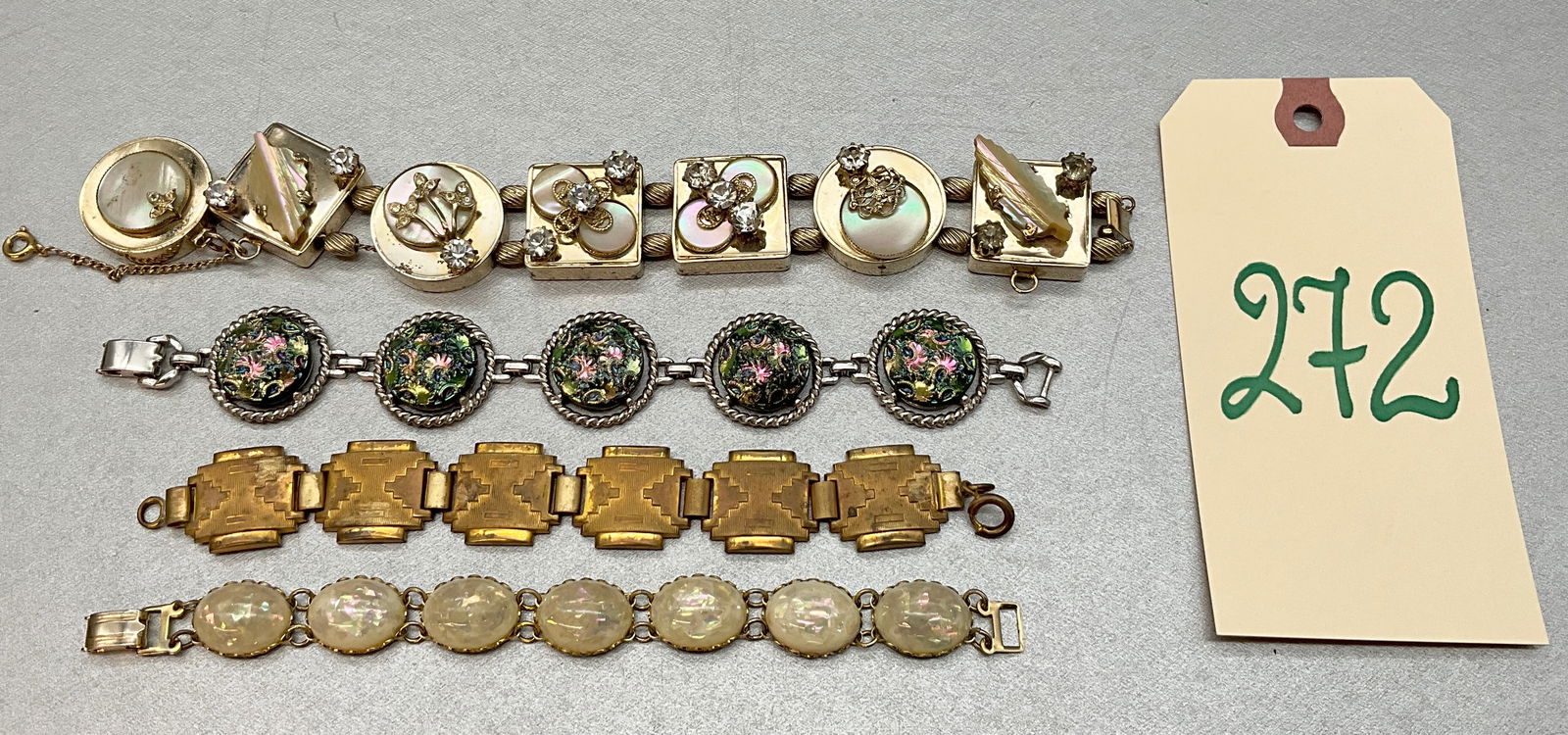 4 PC MOTHER OF PEARL, OPAL, AND MORE BRACELETS.: 4 PC MOTHER OF PEARL, OPAL, AND MORE BRACELETS. FROM CORO, SARAH COV, AND OTHERS. Condition All property is sold in "as is" condition and all sales are final. Teel Auctions and its consignor make no r