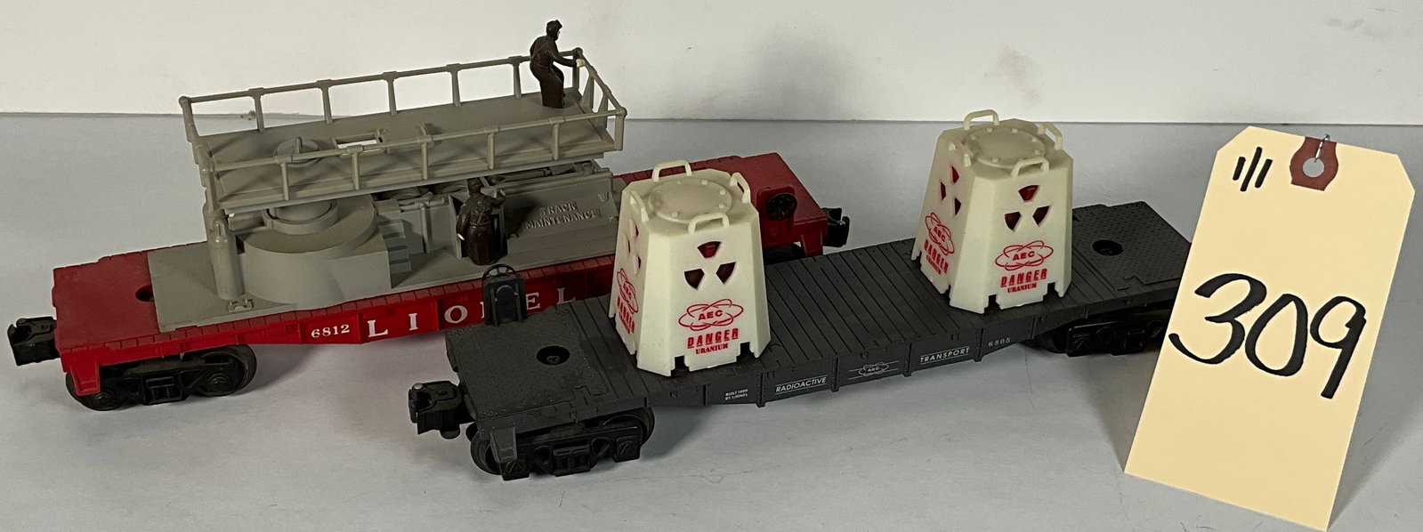 2 PC LIONEL 6812 TRACK MAINTENANCE AND 6805 URANIUM TRANSPORT CARS.: 2 PC LIONEL 6812 TRACK MAINTENANCE AND 6805 URANIUM TRANSPORT CARS. URANIUM CAR GLOWS IN THE DARK Condition All property is sold in "as is" condition and all sales are final. Teel Auctions and its con