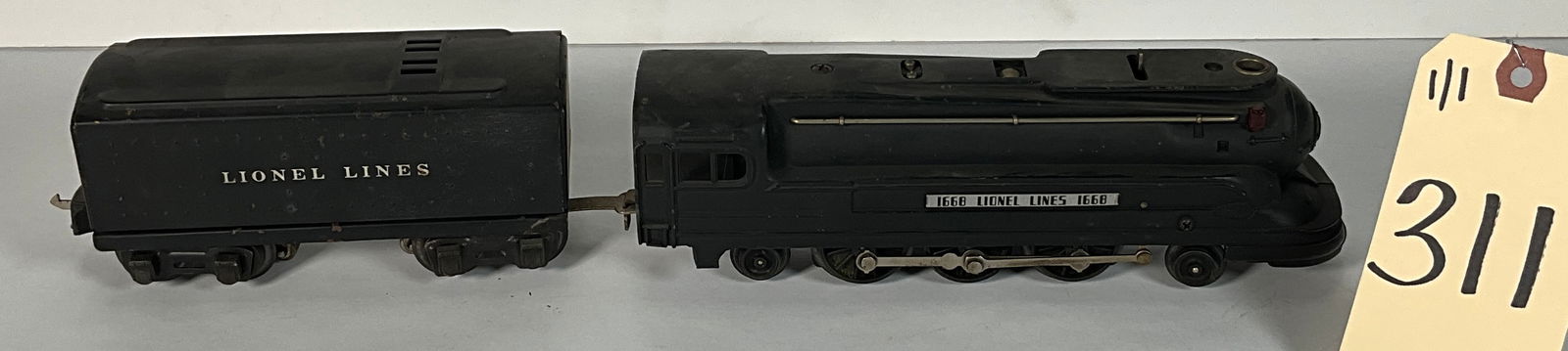 PRE-WAR LIONEL 1668 AND 1689W 2-6-2 STREAMLINE LOCOMOTIVE AND TENDER.: PRE-WAR LIONEL 1668 AND 1689W 2-6-2 STREAMLINE LOCOMOTIVE AND TENDER. Condition All property is sold in "as is" condition and all sales are final. Teel Auctions and its consignor make no representatio
