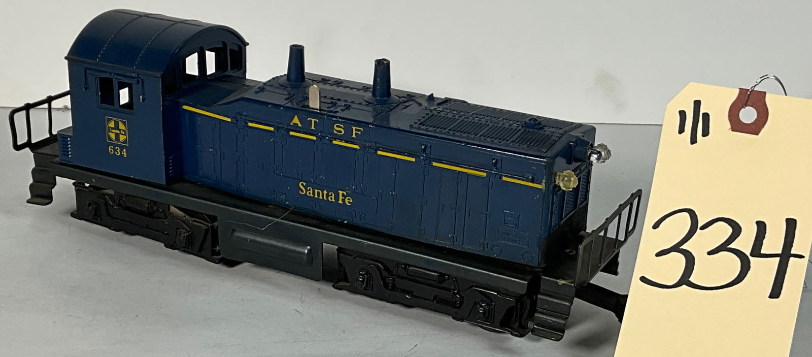 LIONEL AT SF 634 DIESEL SWITCHER.: LIONEL AT SF 634 DIESEL SWITCHER. Condition All property is sold in "as is" condition and all sales are final. Teel Auctions and its consignor make no representations or warranties, express or implied
