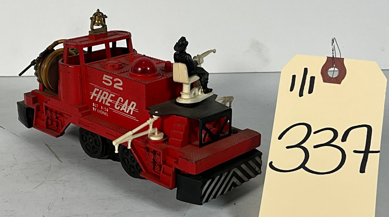 LIONEL FIRE CAR NO 52.: LIONEL FIRE CAR NO 52. Condition All property is sold in "as is" condition and all sales are final. Teel Auctions and its consignor make no representations or warranties, express or implied, with resp