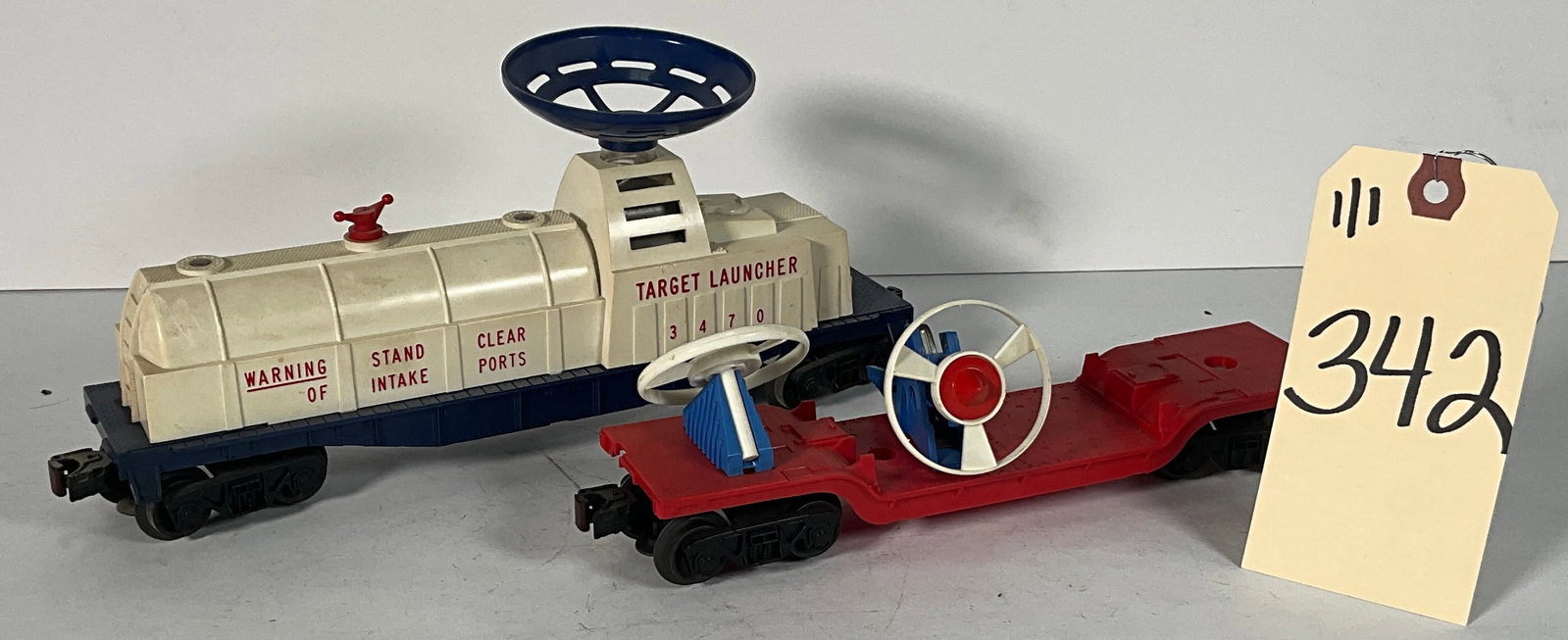 2 PC LIONEL 3470 TARGET LAUNCHER AND FLAT CAR LAUNCHER: 2 PC LIONEL 3470 TARGET LAUNCHER AND FLAT CAR LAUNCHER Condition All property is sold in "as is" condition and all sales are final. Teel Auctions and its consignor make no representations or warrantie