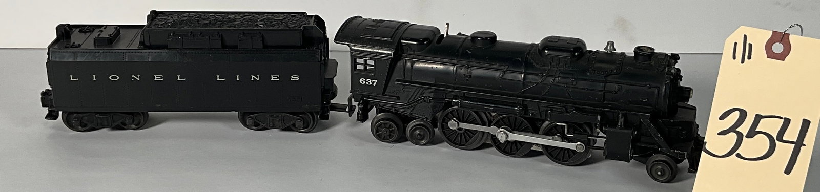 LIONEL 637 2-6-4 LOCOMOTIVE WITH TENDER.: LIONEL 637 2-6-4 LOCOMOTIVE WITH TENDER. Condition All property is sold in "as is" condition and all sales are final. Teel Auctions and its consignor make no representations or warranties, express or 