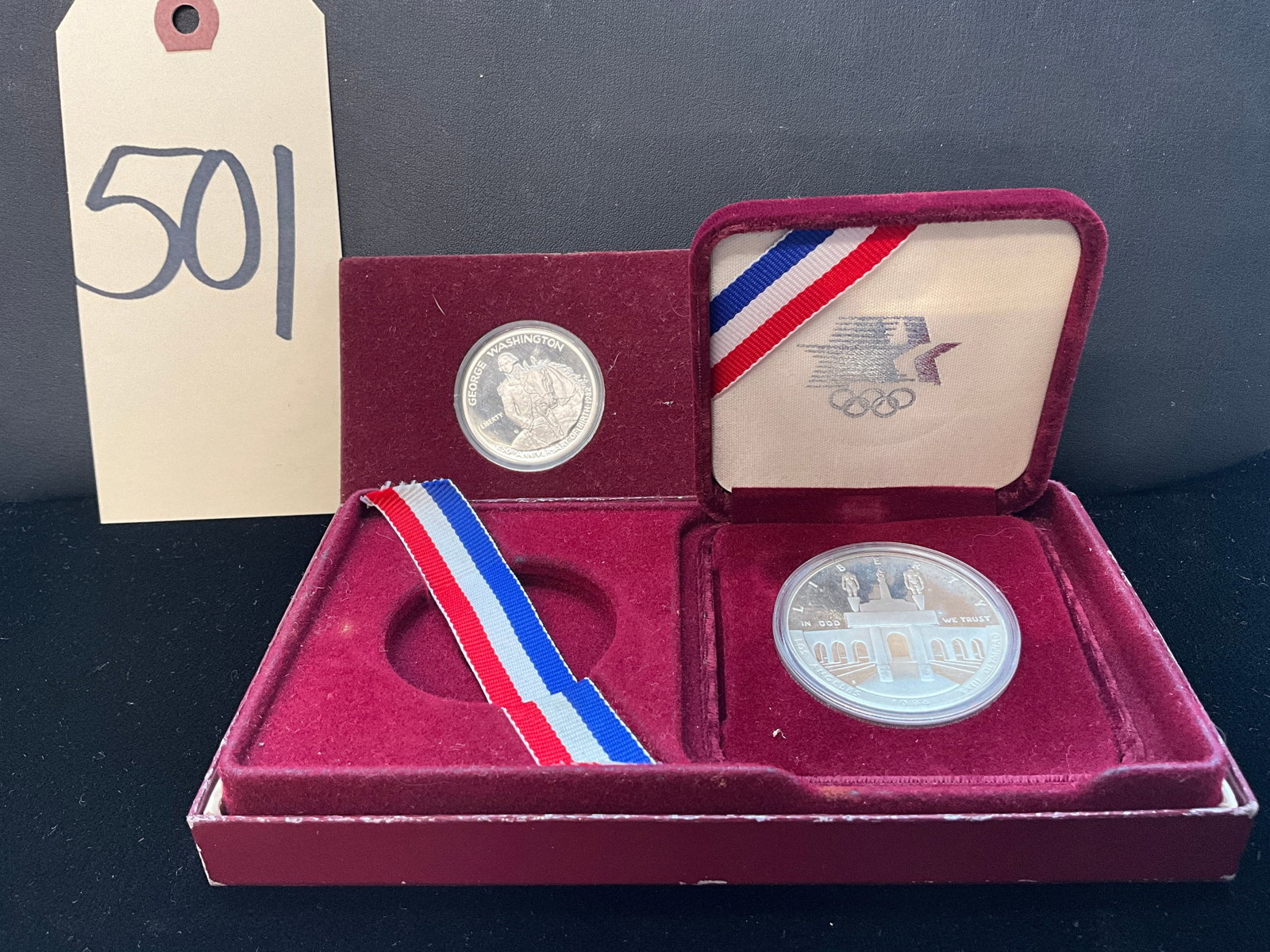 1984 Los Angeles Olympics US Mint Coin with 250th Anniversary George Washington Quarter.: 1984 Los Angeles Olympics US Mint Coin with 250th Anniversary George Washington Quarter. Condition All property is sold in "as is" condition and all sales are final. Teel Auctions and its consignor ma
