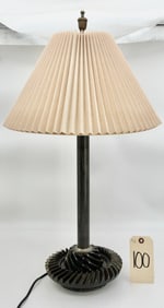 INDUSTRIAL ART HEAVY GEAR BASE TABLE LAMP WITH SIGNED SHADE.