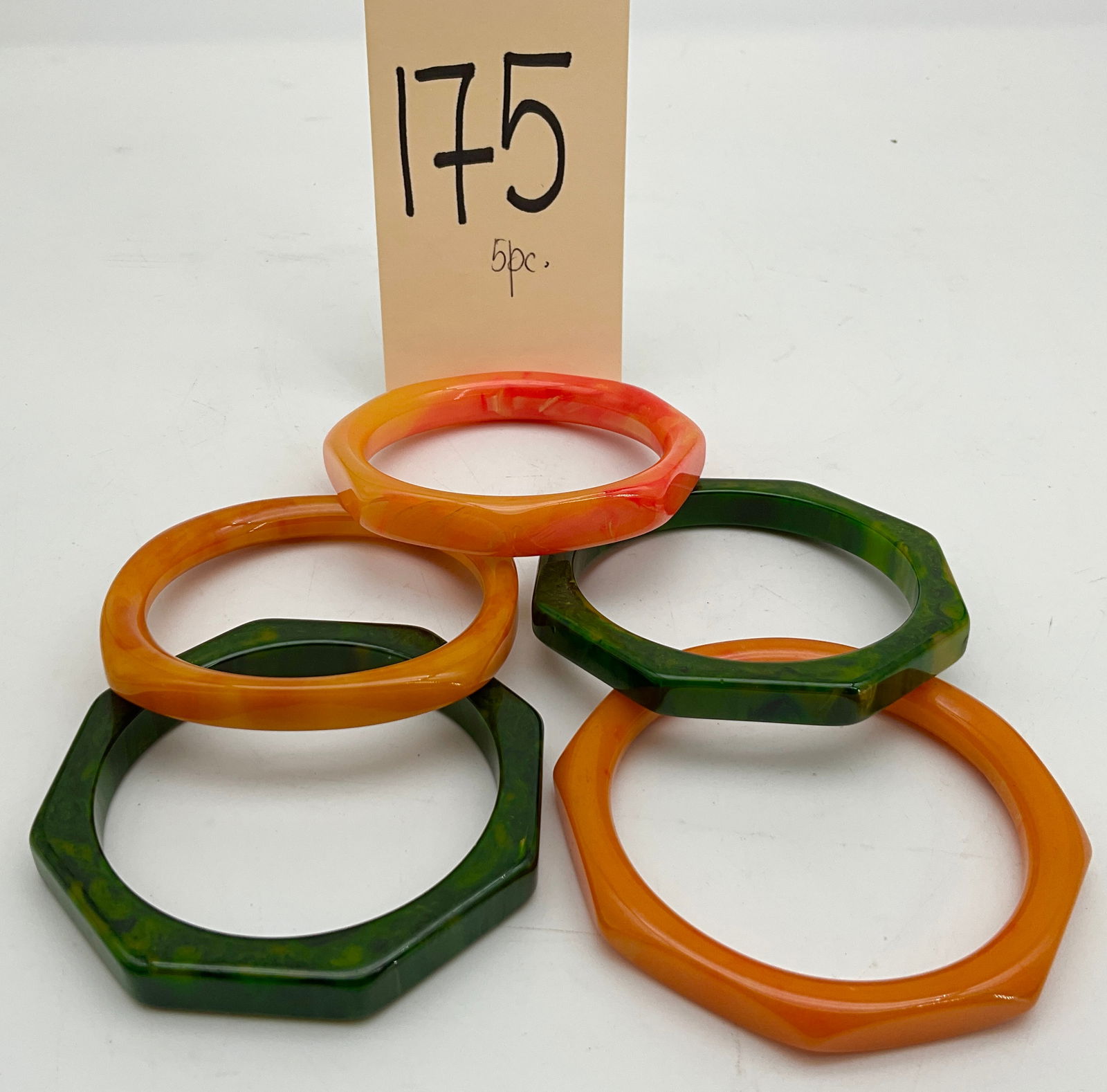 5 PC DECORATED GREEN AND ORANGE BAKELITE BRACELETS. (1 of 2)