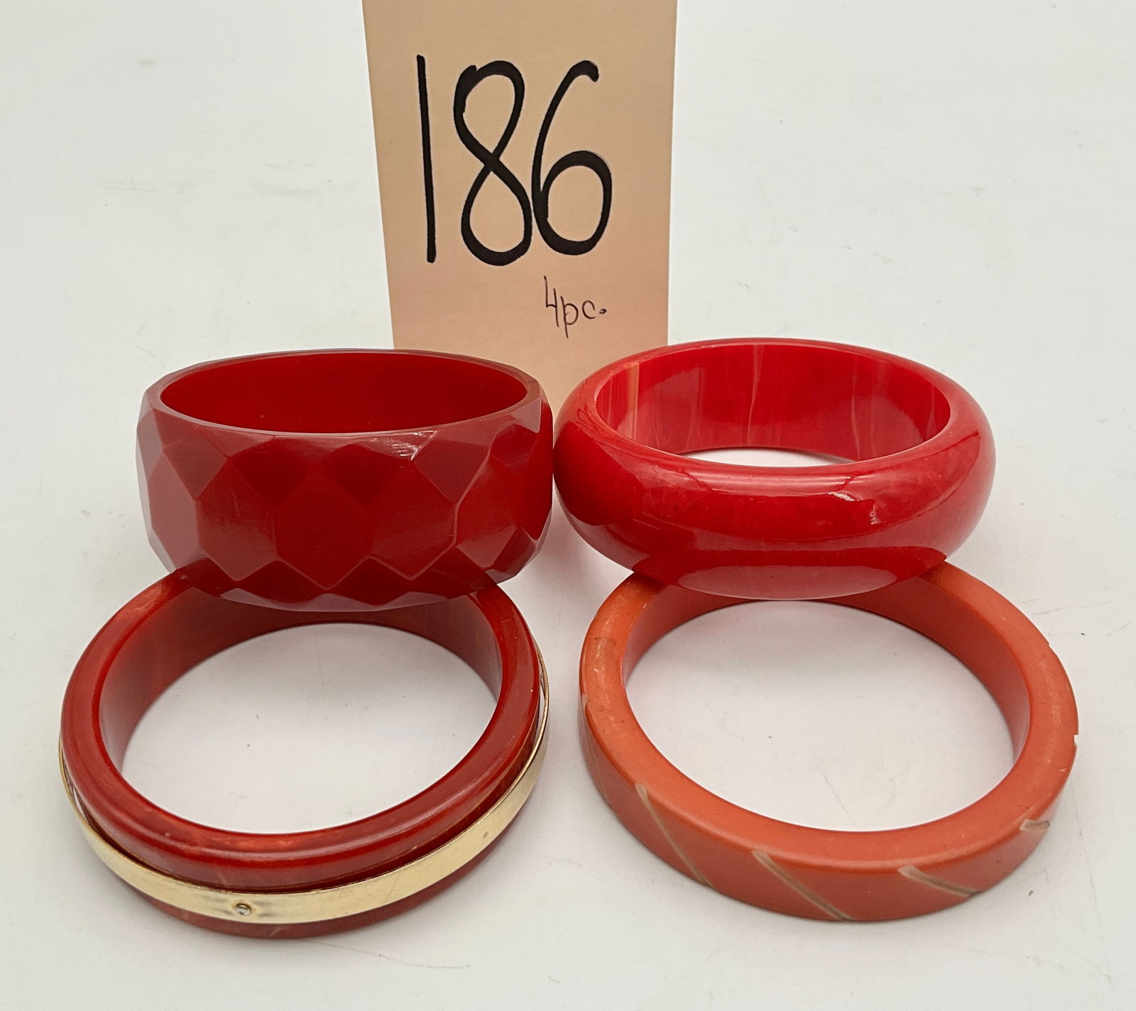 4 PC VINTAGE RED BAKELITE CUFF BRACELETS. (1 of 2)