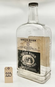 VINTAGE GREEN RIVER WHISKEY BOTTLE WITH ORIGINAL PAPER TAGS AND TOP.