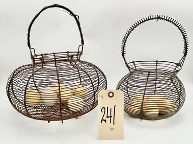 PAIR OF VINTAGE WIRE EGG BASKETS WITH MARBLE EGGS.