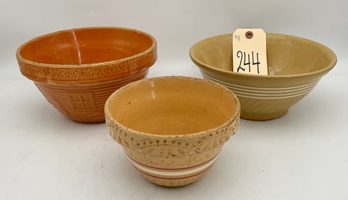 SET OF THREE RELIEF-MOLDED STONEWARE MIXING BOWLS FROM ROSEVILL, HULL, AND OTHER.