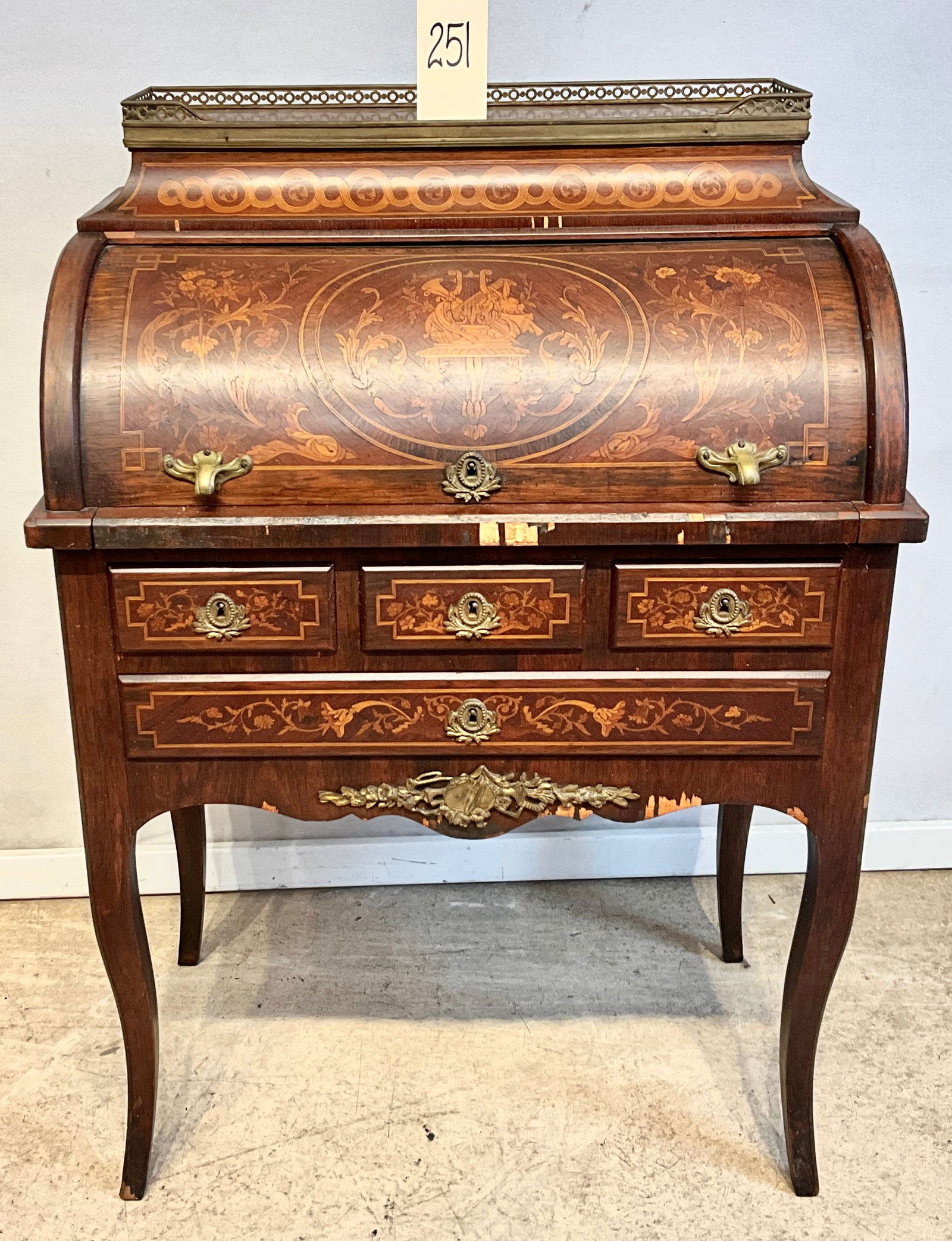 INLAID FRENCH MARQUETRY CYLINDER TOP WRITING DESK WITH BRASS ACCENTS .AS IS.: INLAID FRENCH MARQUETRY CYLINDER TOP WRITING DESK WITH BRASS ACCENTS. MARBLE TOP, BRASS GALLERY, WITH KEY. SELLING AS IS. MEASURES 28" X 17" X 40"H.