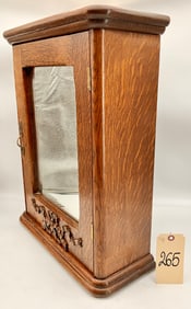 CARVED OAK WALL HANGING MEDICINE CABINET.