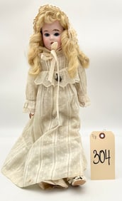 ANTIQUE GERMAN MADE JOINTED BISQUE DOLL.