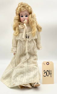 ANTIQUE GERMAN MADE JOINTED BISQUE DOLL.: ANTIQUE GERMAN MADE JOINTED BISQUE DOLL. MEASURES 22"H.