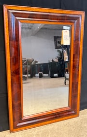 CURLY MAPLE AND MAHOGANY FRAMED EMPIRE STYLE WALL MIRROR.