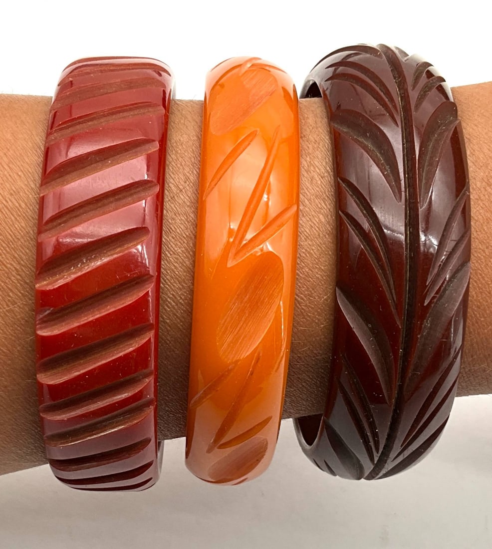 Three Vintage Carved Bakelite Bangles in Red, Orange, and Brown (1 of 2)