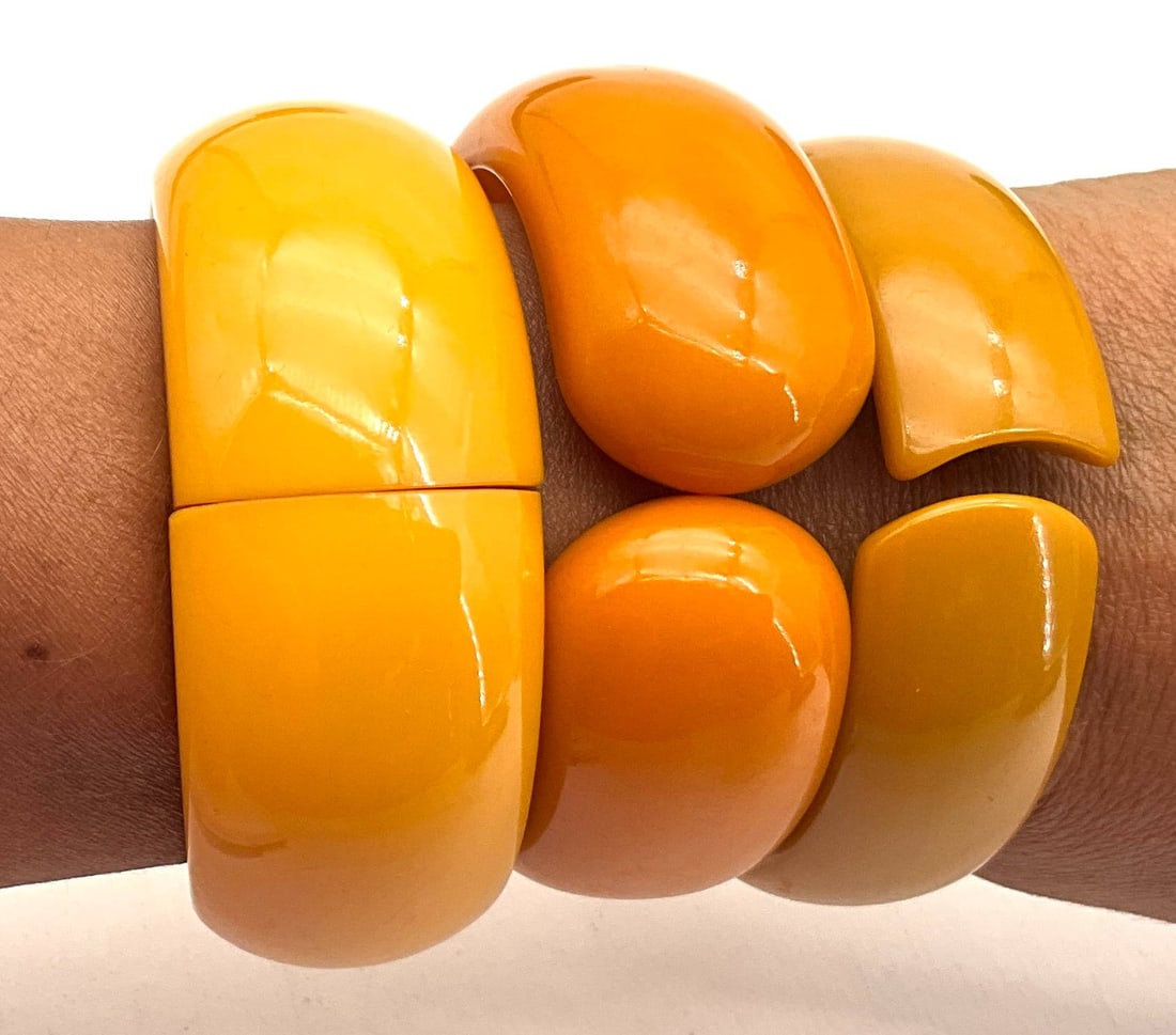 Three Bakelite Hinged Bangle Bracelets in Yellow and Orange Tones (1 of 2)
